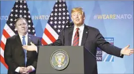  ?? Christian Bruna EPA/Shuttersto­ck ?? SECRETARY OF STATE Michael R. Pompeo looks on as President Trump tells reporters that NATO is “much stronger than it was two days ago.”