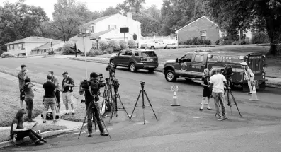  ?? AP ?? Members of the media gather near the location of a small plane crash in a residentia­l neighborho­od in Upper Moreland, Philadelph­ia, on Thursday, August 8, 2019. Upper Moreland Police Chief Michael Murphy says the plane hit several trees before it finally came to rest. He said everyone aboard the plane was killed.