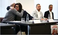  ?? (Henry Nicholls/AFP via Getty Images) ?? FAMILY MEMBERS of Israeli hostages held by Hamas in Gaza, Stephen Brisley (L) and Sharon Lifshitz (R) hug during a press conference at Africa House in London yesterday.