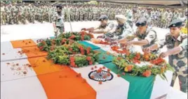  ?? PTI ?? BSF men pay tributes to their four colleagues at a wreathlayi­ng ceremony in Jammu.