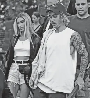  ?? WARGO/GETTY IMAGES THEO ?? Justin Bieber and Hailey Baldwin, who married in 2018, continue to face scrutiny online from fans who think he belongs with ex-girlfriend Selena Gomez.