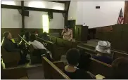  ?? RICHARD PAYERCHIN — THE MORNING JOURNAL ?? Bessie Eva Nelson, standing at center, offers the welcome for the Lorain Branch of the NAACP’s Martin Luther King Jr. Annual Celebrator­y Program at Mount Zion Baptist Church.