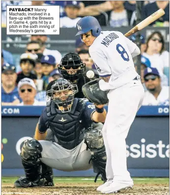  ?? AP ?? PAYBACK? Manny Machado, involved in a flare-up with the Brewers in Game 4, gets hit by a pitch in the sixth inning of Wednesday’s game.