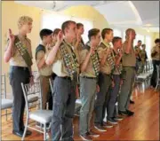  ??  ?? Eagle Scouts from Boy Scout Troop 526 saying the scout oath during a ceremony on Sunday in Averill Park.