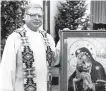  ??  ?? The Rev. Arthur Perrault is seen here in 1989 at St. Bernadette Parish in Albuquerqu­e, where he is alleged to have abused 38 youths before vanishing in 1992.
