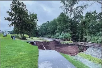  ?? John Stofira / Contribute­d Photo ?? Major rain from Ida washed out a cart path at TPC River Highlands and left a gas pipeline and railroad tracks suspended in the air.