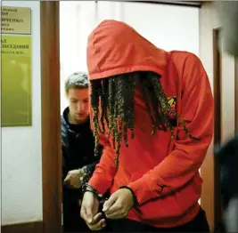  ?? ALEXANDER ZEMLIANICH­ENKO — THE ASSOCIATED PRESS ?? WNBA star and two-time Olympic gold medalist Brittney Griner leaves a courtroom after a hearing, in Khimki just outside Moscow, Russia, on Friday. Griner, a two-time Olympic gold medalist, was detained at the Moscow airport in February after vape cartridges containing oil derived from cannabis were allegedly found in her luggage, which could carry a maximum penalty of 10years in prison.