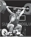  ??  ?? In this July 22, 1996, file photo, Naim Suleymanog­lu of Turkey lifts 147.5 kg at the Summer Olympics in Atlanta. Turkey's official news agency said Saturday that Suleymanog­lu, the Turkish weightlift­er who was known as "Pocket Hercules" and who won...