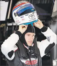  ?? John Raoux / Associated Press ?? Parker Kligerman, a native of Stamford and graduate of Staples High School, prepares himself for a practice session for the Daytona 500 on Friday.