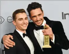  ?? AP PHOTO ?? James Franco, right, poses with brother Dave Franco after winning the award for best performanc­e by an actor in a motion picture – musical or comedy for “The Disaster Artist,” at the InStyle and Warner Bros. Golden Globes afterparty Sunday in Beverly...