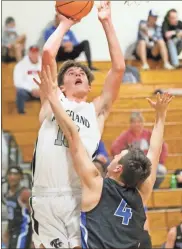  ?? Scott Herpst ?? Ridgeland’s Judd Anderson attempts a shot over the outstretch­ed arms of Ringgold’s Gage Long. Anderson scored 21 points to help the Panthers to their first win of the season, 68-65, on Saturday night.