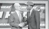  ?? AP/FILE ?? Justise Winslow, right, meets NBA commission­er Adam Silver after being selected 10th overall by the Heat in 2015.