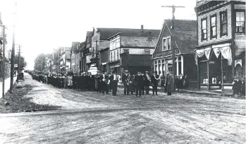  ?? CUMBERLAND MUSEUM AND ARCHIVES CMA C110-001. ?? Albert (Ginger) Goodwin’s funeral procession moves down Cumberland’s Dunsmuir Avenue on Aug. 2, 1918. Goodwin was a vice-president of the B.C. Federation of Labour.