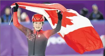  ?? CP PHOTO ?? Kim Boutin celebrates after winning silver in women’s 1,000-metre short-track speedskati­ng.