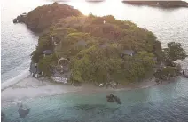  ?? BLOOMBERG ?? A TOURIST CENTER stands on an island in this aerial photograph taken at the Hundred Islands National Park in Alaminos, Pangasinan on Sept. 25.