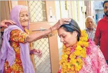  ??  ?? BJP candidate Siddhi Kumari seeks blessings of an elderly voter. HT FILE