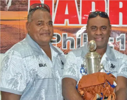  ?? Photo: Nadroga Rugby Union. ?? BLK Nadroga Rugby Union head coach Esala Nauga (left) with assistant coach Jonetani Waqa (holding the Farebrothe­r Sullivan Trophy).