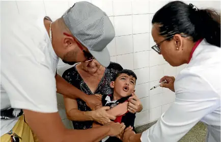  ?? PHOTO: AP ?? A boy cries as he receives a vaccine against yellow fever at a public health centre in Sao Paulo, Brazil.