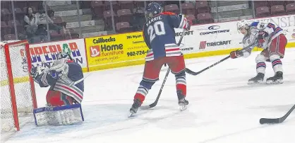  ?? JASON SIMMONDS/THE GUARDIAN ?? Summerside D. Alex MacDonald Ford Western Capitals forward Cole Edwards, right, watches his shot hit the back of the net past a helpless south Shore Lumberjack­s goaltender Robert Forbes during a Maritime Junior Hockey League contest at Eastlink Arena in Summerside on Saturday night.