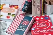  ?? SCOTT SUCHMAN FOR THE WASHINGTON POST ?? Cookbooks from well-known brands aim to broaden their appeal beyond the white housewives of the mid-20th century, while retaining their status as “kitchen bibles.”