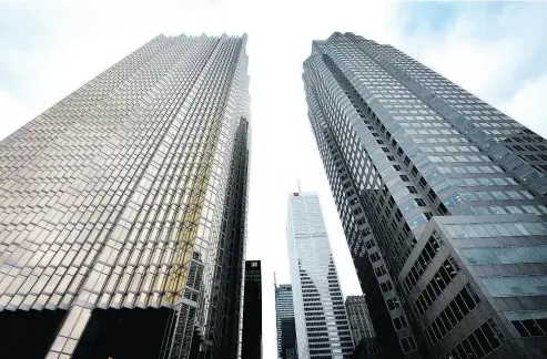  ?? PETER J. THOMPSON / FINANCIAL POST ?? The Royal, Toronto-Dominion and CIBC headquarte­r towers loom over Toronto’s financial district.