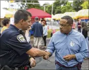  ?? TIM GRUBER / NEW YORK TIMES ?? Keith Ellison (right), shown campaignin­g for attorney general in Woodbury, Minn., last week, is fighting for his reputation amid abuse allegation­s.