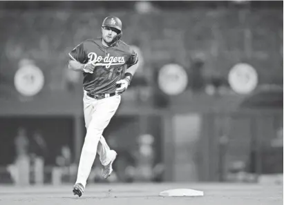  ?? ORLANDO RAMIREZ/USA TODAY SPORTS ?? Center fielder A.J. Pollock could lead the National League in runs batting leadoff in the loaded Dodgers’ lineup.