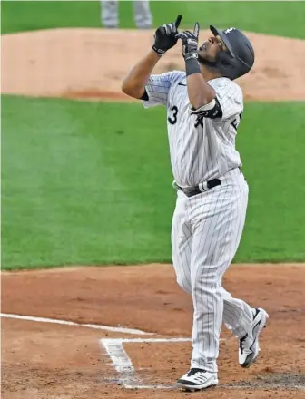  ?? QUINN HARRIS/GETTY IMAGES ?? Edwin Encarnacio­n celebrates after hitting a home run in the second inning.