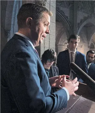  ?? ADRIAN WYLD THE CANADIAN PRESS ?? Federal Conservati­ve Leader Andrew Scheer rejected the idea his party would have to “cut like crazy” to balance the budget if it formed a government.