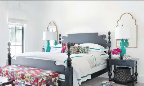  ?? SARAH DORIO/BETSY BURNHAM/THE ASSOCIATED PRESS ?? Lush linens and throw pillows add welcoming luxury to this guest bedroom.