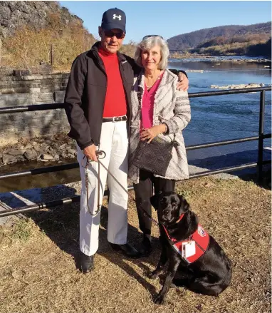  ?? PICTURE: WASHINGTON POST ?? SPUNKY: Air Force veteran Michael Harris and his wife, Lucy, with his Hero Dog, Gracie.