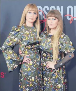  ?? CHRIS PIZZELLO/AP ?? Holly Laessig, left, and Jess Wolfe, who comprise the duo Lucius, arrive at the MusiCares Person of the Year gala honoring Joni Mitchell on April 1 in Las Vegas.