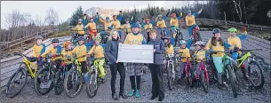  ?? Photo: Abrightsid­e Photograph­y. ?? Liberty representa­tives handover the cheque to the West Highland Wheelers at Nevis Range.