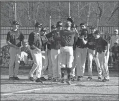  ?? The Sentinel-Record/Grace Brown ?? HOME SWEET HOME: Fountain Lake’s baseball team celebrates at home plate after Daeton Bassett’s (24) three-run home run Tuesday at Cutter Morning Star’s baseball field. The Cobras host Magnet Cove Thursday and Bauxite Friday.