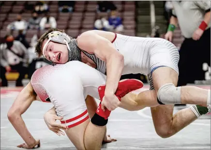  ?? NATE HECKENBERG­ER - FOR MEDIANEWS GROUP ?? West Chester Henderson’s Sammy McMonagle — with both nostrils stuffed to stop blood from flowing — wrestles during the state championsh­ip meet Saturday.