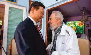  ??  ?? HAVANA: In this July 22, 2014 file photo, Cuba’s former President Fidel Castro (right) greets China’s President Xi Jinping in Havana. — AP