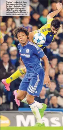  ??  ?? Chelsea’s striker Loic Remy (left) vies against Maccabi Tel Aviv’s defender Omri Ben Harush during their UEFA Champions League match at Stamford Bridge in London yesterday. –