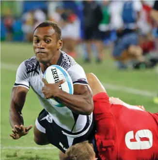  ??  ?? Osea Kolinisau scores the first try for Team Fiji men’s rugby side in the final against Great Britain, on their way to the gold medal win at the 2016 Olympic Games in Rio de Janeiro, Brazil.