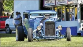  ??  ?? Heads turned as Shane Ott pulled onto the Navy Yard show grounds with his five-window, mega-motor street rod.