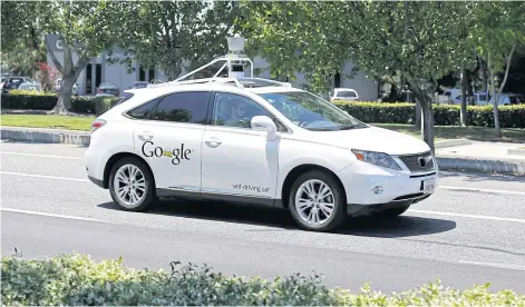  ??  ?? A Google self-driving car goes on a test drive near the Computer History Museum in Mountain View, California.