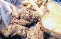  ?? LAUREN DELGADO/ ORLANDO SENTINEL ?? Huey Magoo's combo deal comes with three, five or seven tenders, fries and Texas toast.