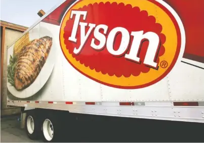  ?? ASSOCIATED PRESS FILE PHOTO ?? A Tyson Foods Inc. truck is parked at a warehouse in Little Rock, Ark. Tyson Foods said a strain of bird flu sickened chickens at a poultry breeder that supplies it with birds.