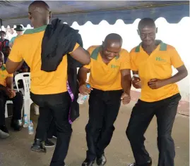  ??  ?? Inmates dance to celebrate their graduation in Informatio­n Technology at Bulawayo Prison recently