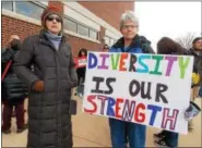  ??  ?? Hamburg resident Lori Peters and Fleetwood resident Brydee Farmer were among the Berks County community members to join the Solidarity March on the Kutztown University campus on Feb. 16.
