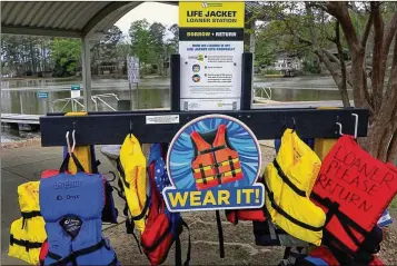  ?? COURTESY OF MIKE HASKEY ?? Seven life jacket loaner stations opened in late March around the Chattahooc­hee Valley. Boaters and their passengers can borrow the life jackets at no cost, then return them at the end of the day.