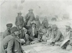  ??  ?? “A group of Indians seated in a circle, playing a game. 1900.” No location is given, although elders in Pasqua First Nation have been identified the men as playing hand games.