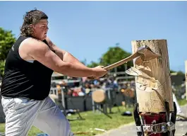  ?? JOSEPH JOHNSON/ STUFF ?? Curtis Bennett, 19, from Australia, competes in the wood chopping competitio­n during the New Zealand Agricultur­al Show yesterday.