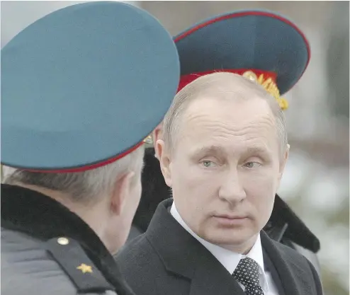  ?? NATALIA KOLESNIKOV­A / AFP / GETTY IMAGES ?? Russian President Vladimir Putin says his country’s main goals have been achieved, but he made it clear
Russia will maintain its airbase and a naval facility in Syria and keep some troops there.