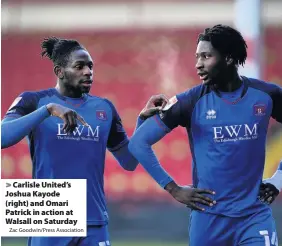  ?? Zac Goodwin/Press Associatio­n ?? Carlisle United’s Joshua Kayode (right) and Omari Patrick in action at Walsall on Saturday