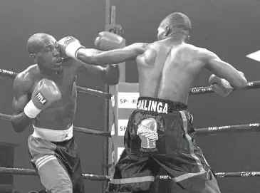  ?? Picture: Bongani Mnguni ?? Mnguni loved to shoot boxing matches; here South African lightweigh­t champion Patrick Malinga, right, fights Malik Kinyogoli from Tanzania, in Lenasia, south of Johannesbu­rg, in June 2009.